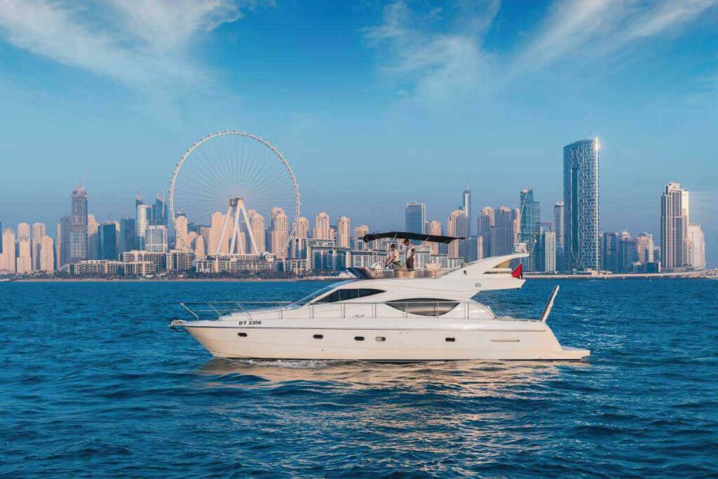 Aliona 50ft luxury yacht cruising in Dubai Marina with city skyline view